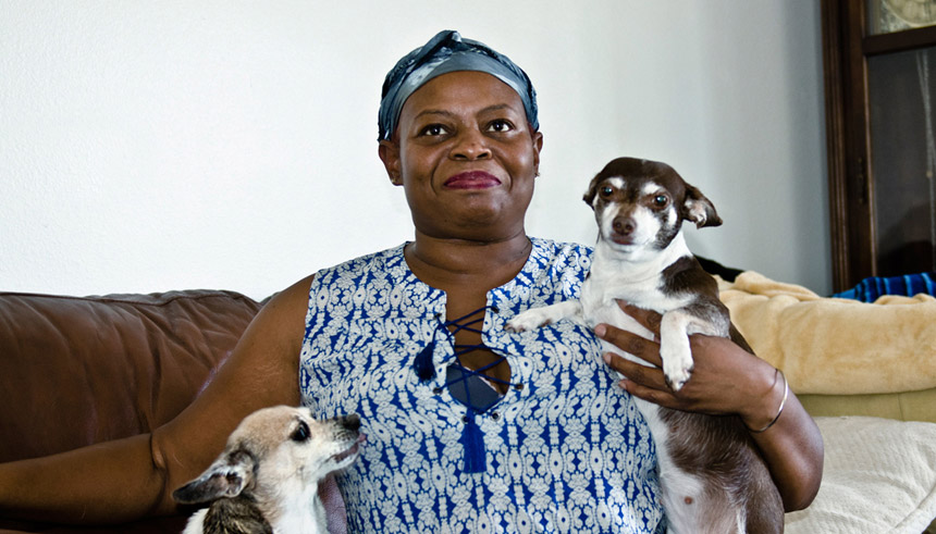 United Way veteran beneficiary Marva Lewis at home with her two dogs